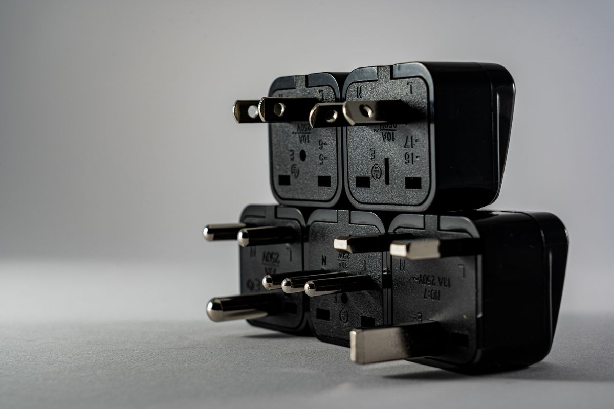 A close view of electrical plug adapters arranged together